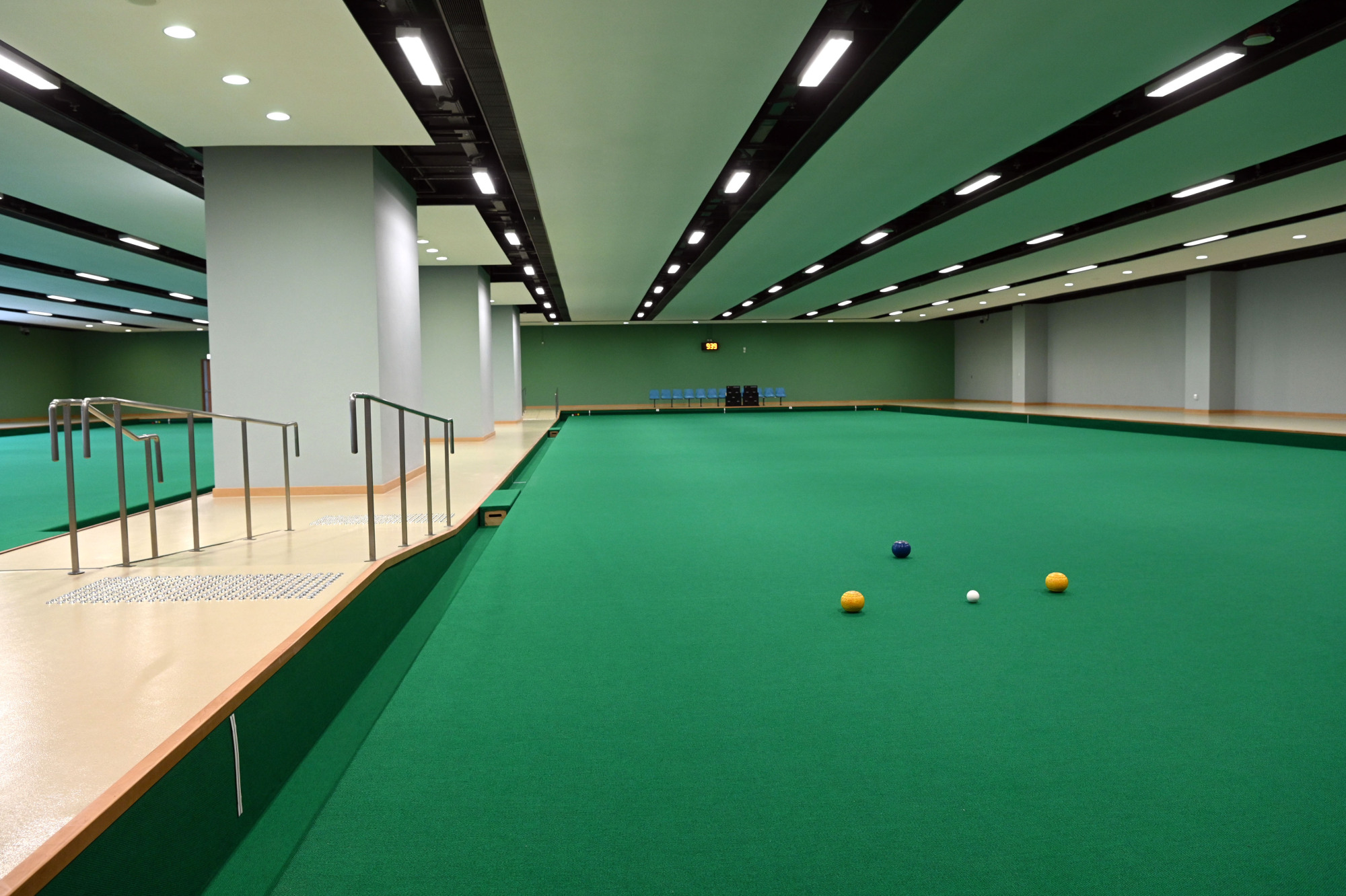 Modern indoor lawn bowls green at Tung Cheong Street Sports Centre.